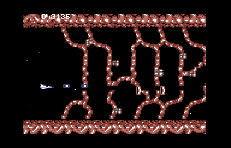 Life Force Commodore 64 Screenshot: You need to shoot your own path in this section of the game...