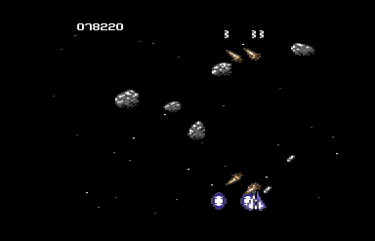 Life Force Commodore 64 Screenshot: Some enemies explode into multiple shards after you shoot them.