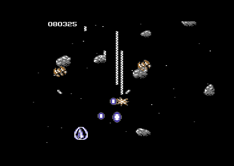 Life Force Commodore 64 Screenshot: Opponents still attack you in the middle of the asteroids...