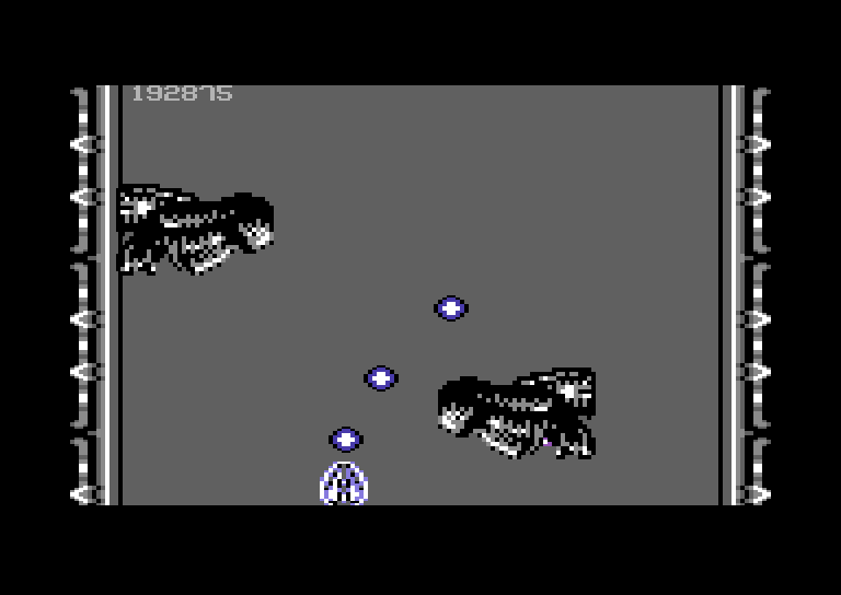 Life Force Commodore 64 Screenshot: Giant heads attacking!