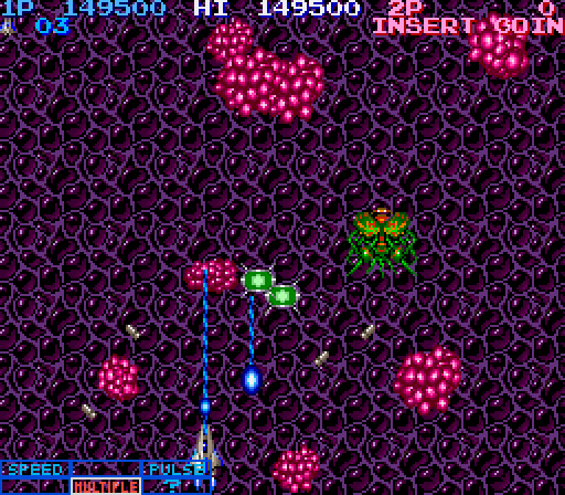 Life Force Arcade Screenshot: Collect those green capsules to advance the power up meter.
