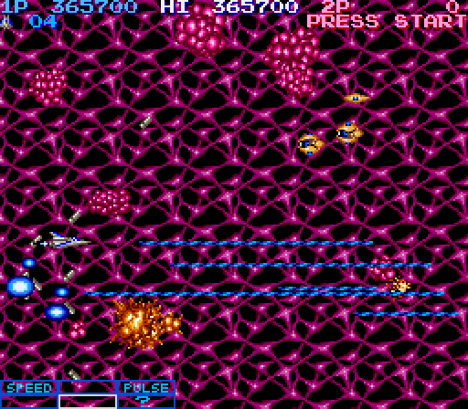 Life Force Arcade Screenshot: Those pink asteroids can't be destroyed...dodge them!