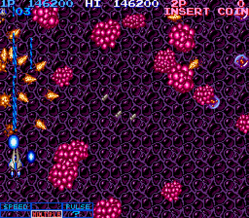 Life Force Arcade Screenshot: Some opponents explode into shrapnel when you shoot them.