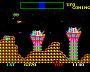 Cosmic Avenger for Arcade - UFO appears and attacks from behind.