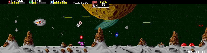 Darius Arcade Screenshot: Collect the silver orb for bonus points; shoot the blue opponent to release a shield power up.