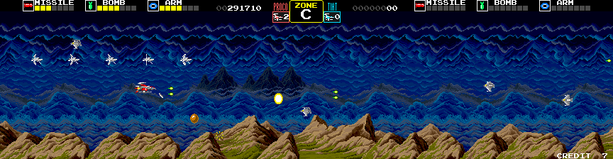 Darius Arcade Screenshot: Zone C; collect the gold sphere to destroy all opponents on the screen.