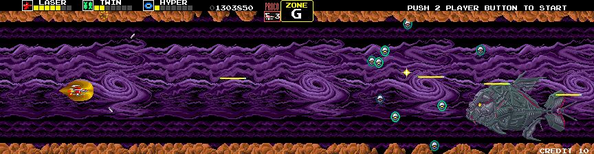 Darius Arcade Screenshot: Fatty Glutton slowly appears from the bottom of the screen.