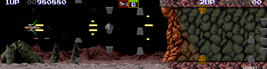 Darius II Arcade Screenshot: The cave ahead is blocked...I need to shoot my way through...