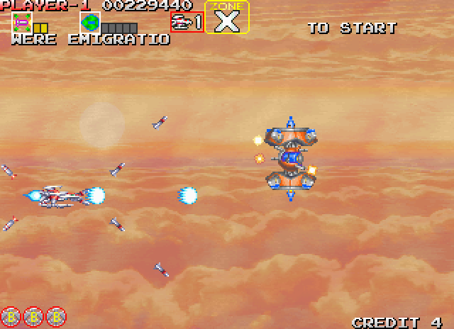 Darius Gaiden Arcade Screenshot: Zone X begins in a cloudy area.