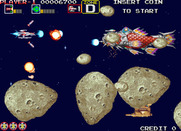 Darius Gaiden for Arcade - The large asteroids break into smaller ones if you shoot them...