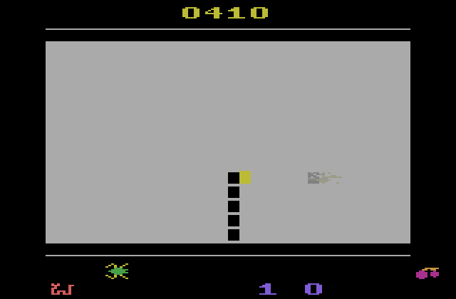 Tape Worm Atari 2600 Screenshot: Use the joystick button or collect a bean to temporarily light up the screen.