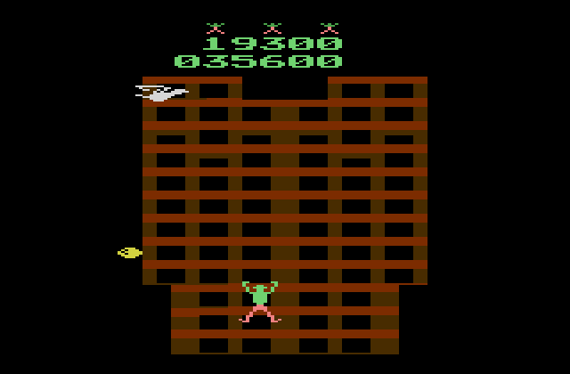 Crazy Climber Atari 2600 Screenshot: A bird dropping eggs guards the top of the building.