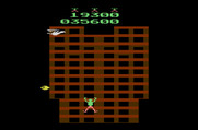 Crazy Climber for Atari 2600 - A bird dropping eggs guards the top of the building.
