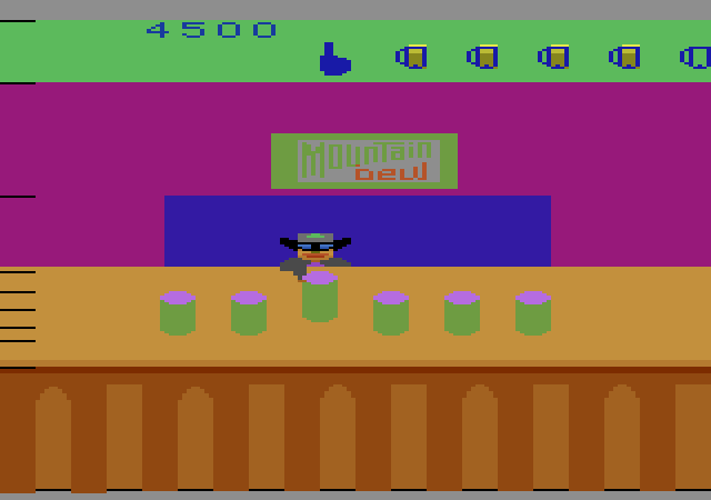 Tapper Atari 2600 Screenshot: This guy shakes up the cans; can you find the one that hasn't been shaken?