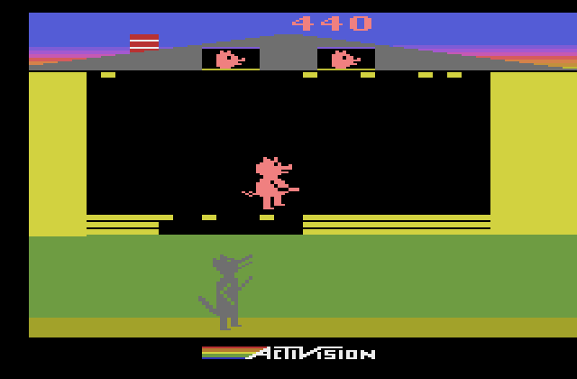 Oink! Atari 2600 Screenshot: Fill the gaps in the wall so the wolf can't get you!