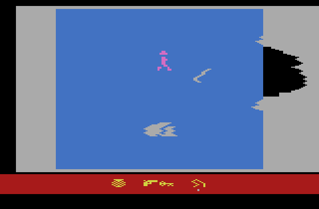Raiders of the Lost Ark Atari 2600 Screenshot: One way to get to the next room is to blow a hole in the wall...