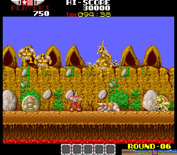 Rygar for Arcade - Opponents crawl out of those huts to attack you!