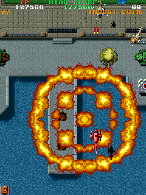 Twin Cobra Arcade Screenshot: Bombing some ships...