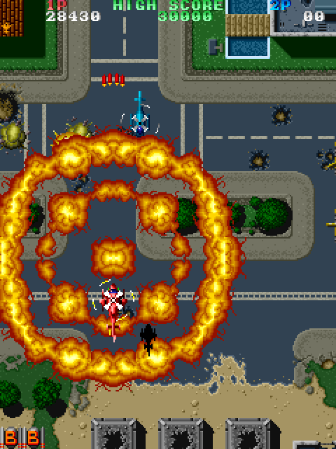 Twin Cobra Arcade Screenshot: Use bombs to destroy a large number of opponents easily.
