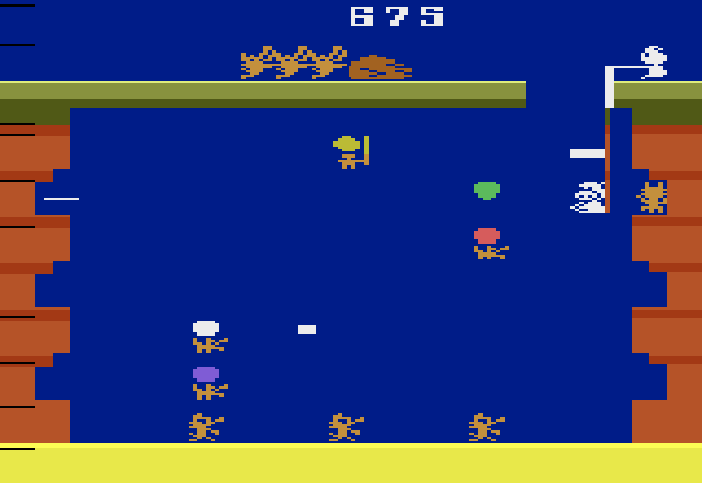 Pooyan Atari 2600 Screenshot: A few more wolves, and they will be able to push that rock!