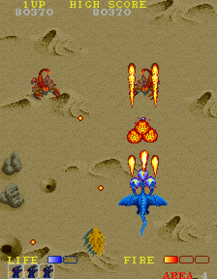 Dragon Spirit Arcade Screenshot: Fighting giant desert creatures!