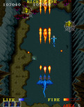 Dragon Spirit for Arcade - Spiders, bats, and other creatures appear in the cave.