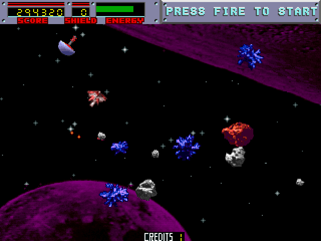 Blasteroids Arcade Screenshot: The blue asteroids become locked in place after shooting them.