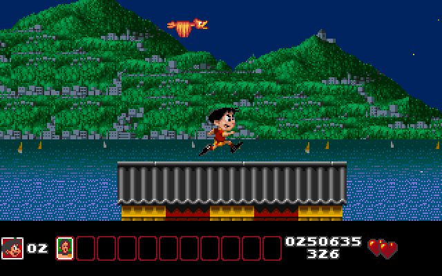 Soccer Kid IBM PC/Compatibles Screenshot: Picking up items on the roof...