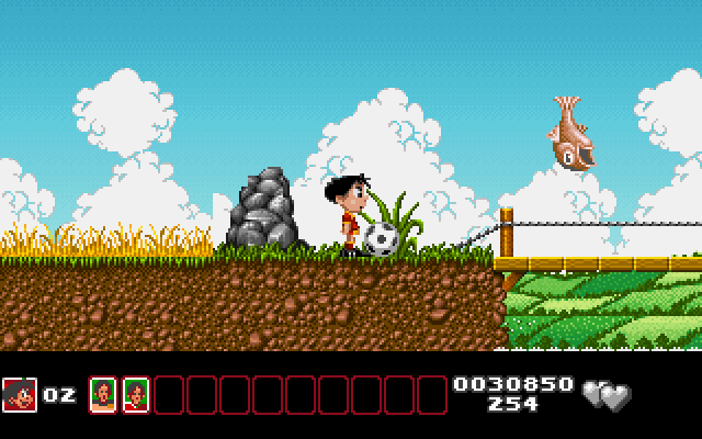 Soccer Kid IBM PC/Compatibles Screenshot: You can either avoid the jumping fish or hit them with the soccer ball.