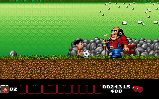 Soccer Kid IBM PC/Compatibles Screenshot: Hit this big guy with the soccer ball a few times to knock him down.