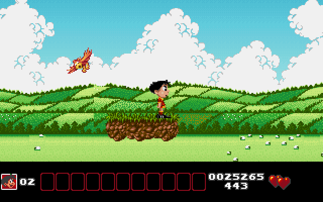 Soccer Kid IBM PC/Compatibles Screenshot: Jumping through the countryside; avoid those birds, they are quick!