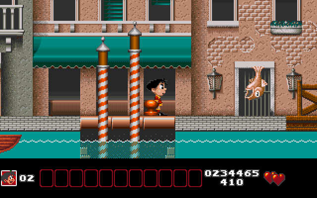 Soccer Kid IBM PC/Compatibles Screenshot: Fish jump out of the water as you try to navigate through Venice.