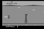 Barnstorming for Atari 2600 - Avoid obstacles, such as these windmills...