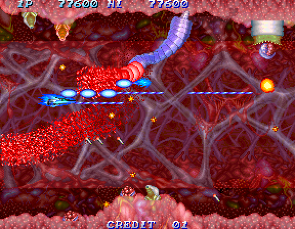 Salamander 2 Arcade Screenshot: Destroying worm-like opponents.