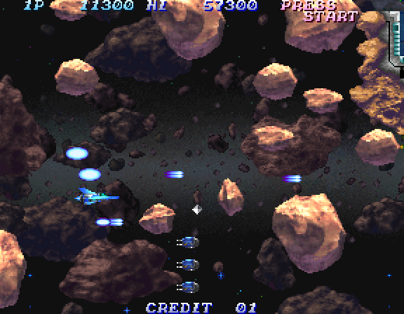 Salamander 2 Arcade Screenshot: A large wave of asteroids approaches.