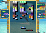 Arkanoid Returns for Arcade - Player one has a large paddle temporarily.
