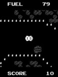 Super Bug for Arcade - Avoid the sand as well; it may knock you off the road...