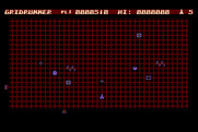 Gridrunner for Atari 8-bit - Blasting opponents as more obstacles appear on the grid...