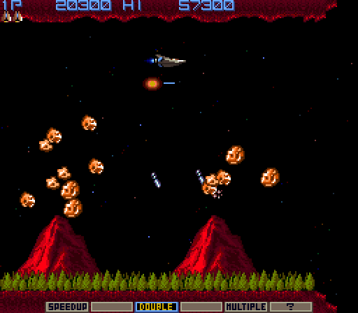 Gradius Arcade Screenshot: Near the end of the level these two volcanoes launch rocks at you...