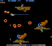 Gradius for Arcade - The Moai heads start appearing...