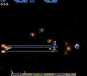 Gradius for Arcade - Each level begins with a chance to pick up a few power ups...