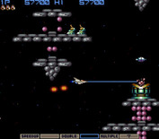 Gradius for Arcade - The screen also scrolls vertically to follow the player movement in this section.