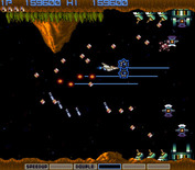 Gradius for Arcade - The next stage resemble the first one, but there is much more firepower to avoid now!