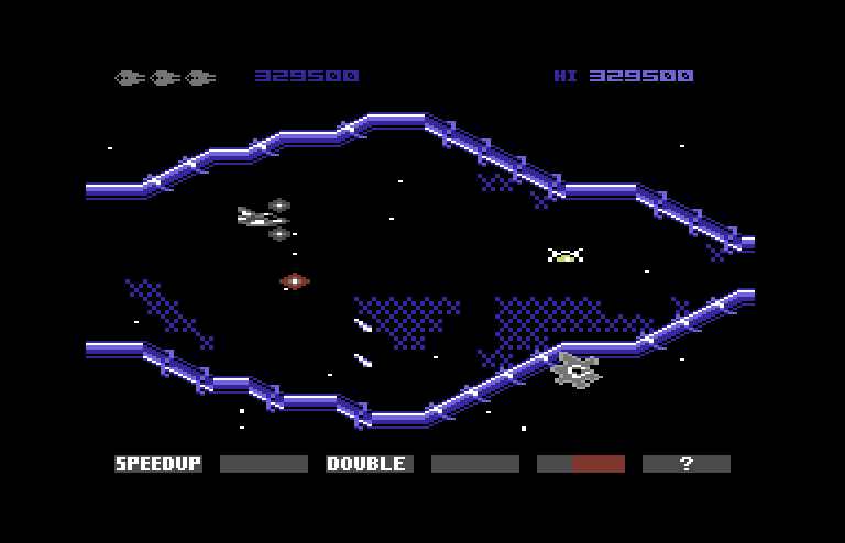 Gradius Commodore 64 Screenshot: Strange amoeba wait on the sidelines to attack when you get near.