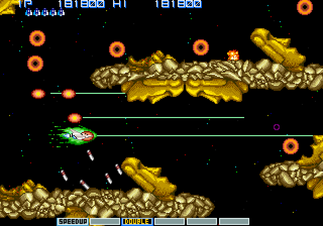 Vulcan Venture Arcade Screenshot: The next stage features the classic Gradius "Moai"...