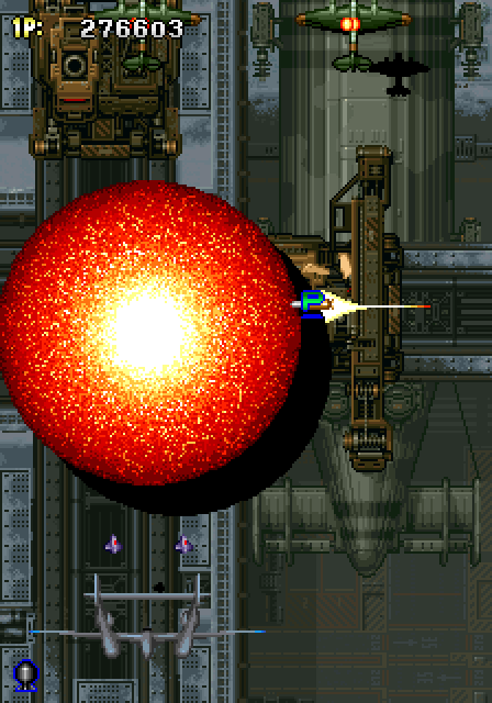 Strikers 1945 Arcade Screenshot: You have a limited number of large bombs which do quite a bit of damage...