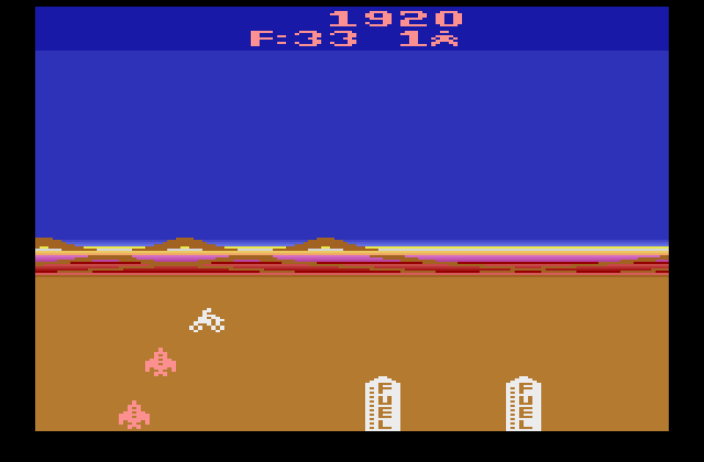 Mega Force Atari 2600 Screenshot: Destroy the fuel tanks for bonus fuel...