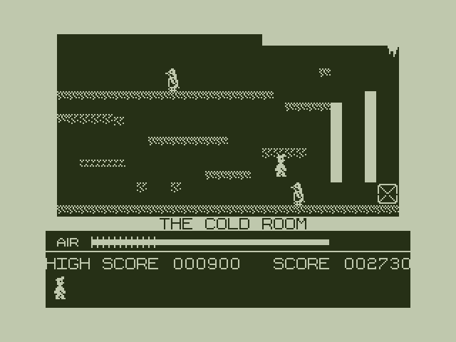 Manic Miner Dragon 32/64 Screenshot: Jumping over a penguin...