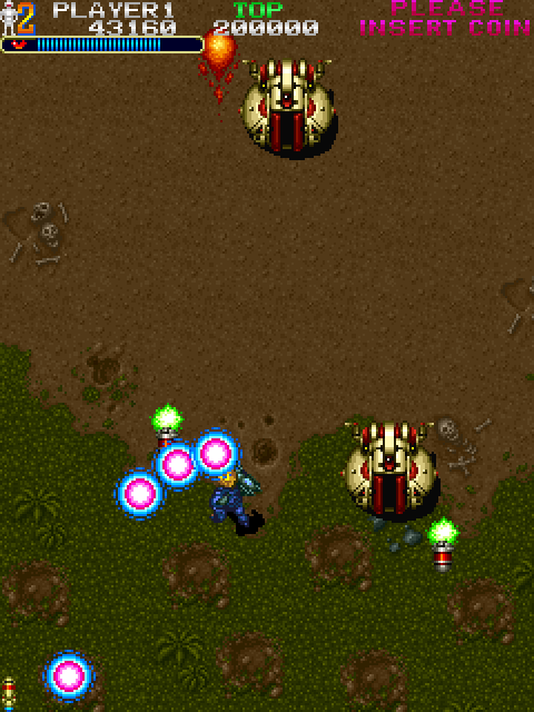 Out Zone Arcade Screenshot: Various weapons can be picked up to help you out...