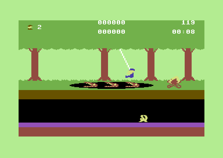 Trapfall Commodore 64 Screenshot: Use vines to swing over pits.